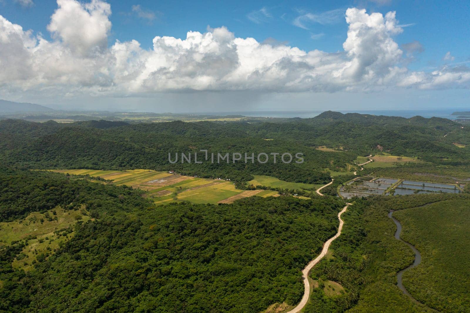 Mountain slopes with rainforest and a mountain valley with farmland.Philippines.