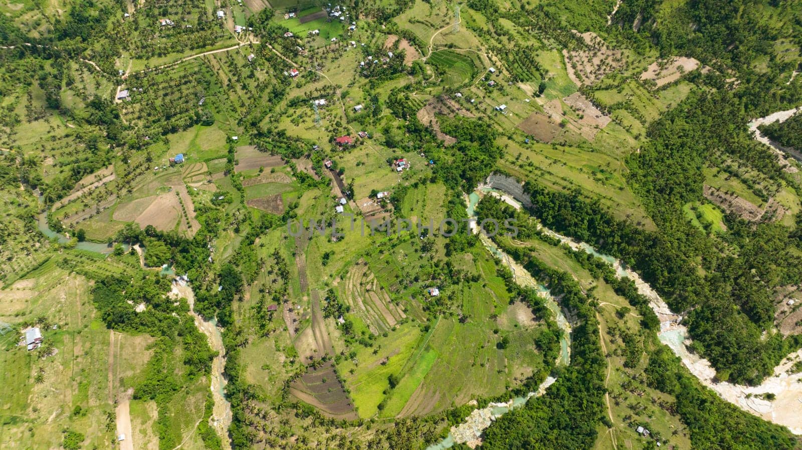Aerial view of farm and agricultural land with crops in the mountainous area. Cebu island, Philippines.