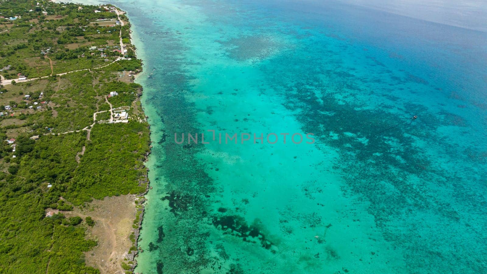 Aerial view of Tropical sandy beach and blue sea. Bantayan island, Philippines.