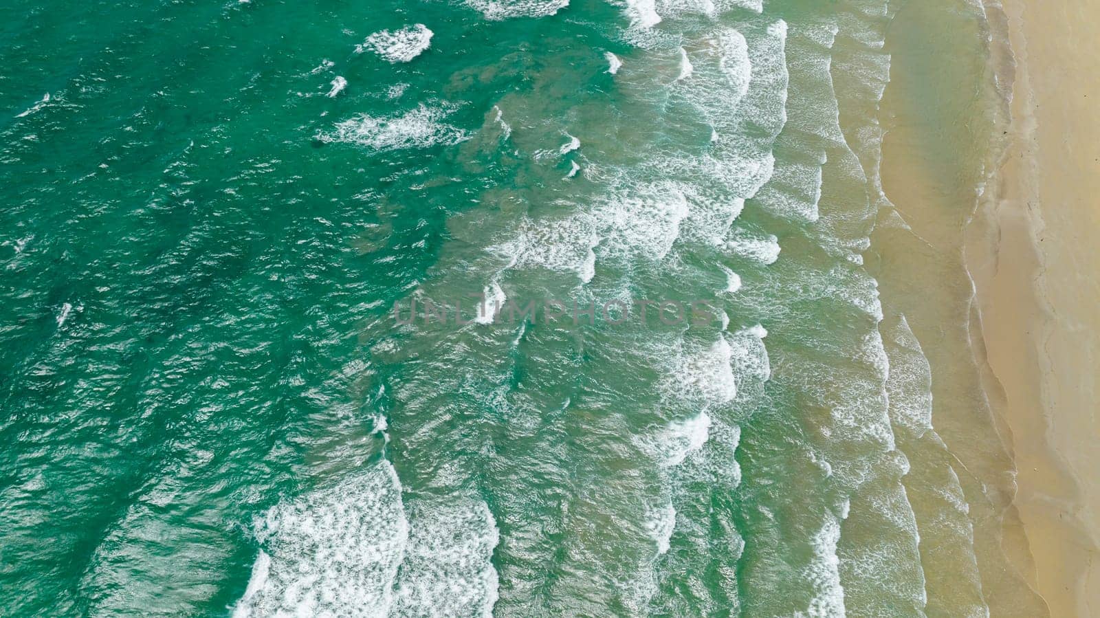 Aerial drone of sandy beach and tropical sea. Beautiful sea landscape beach. Borneo, Malaysia.