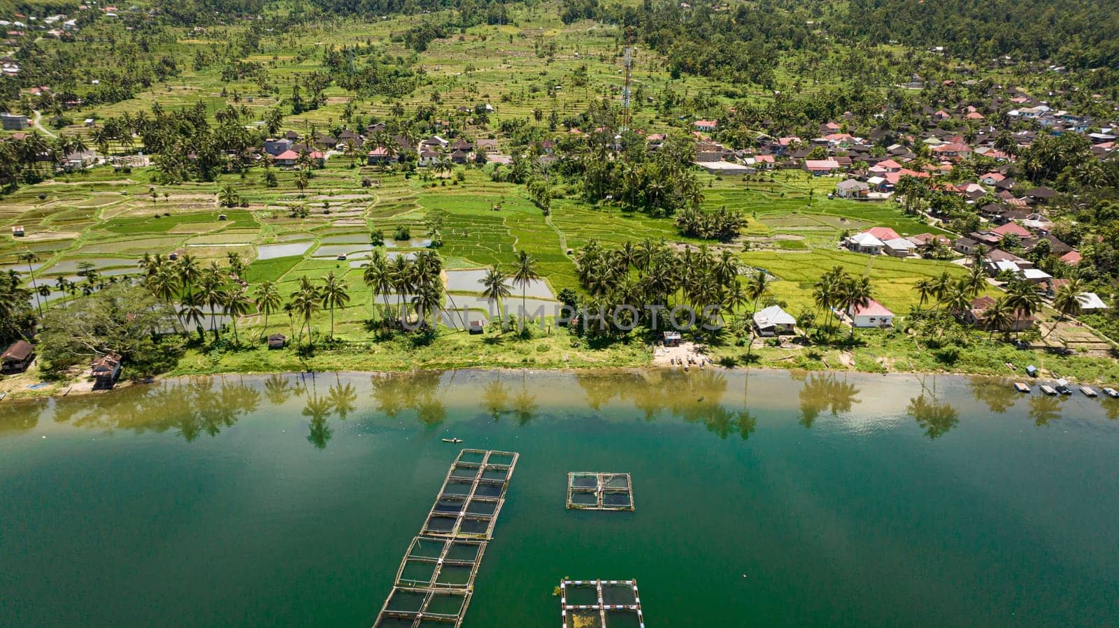 Aerial view of agriculture in Sumatra with farmland and fish farm. Sumatra. Indonesia.
