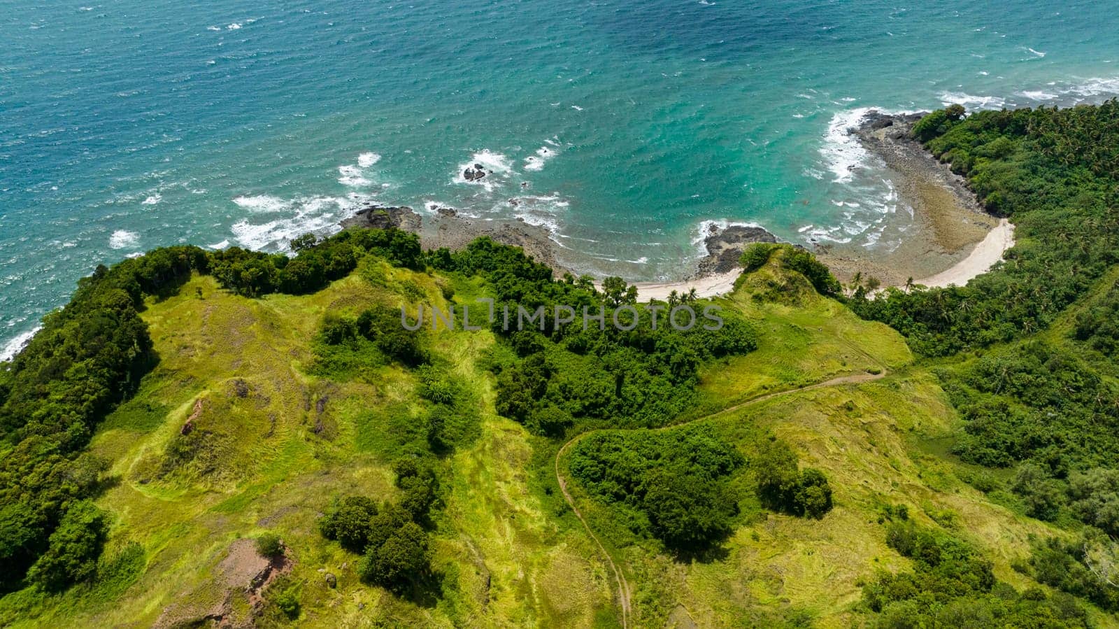 Coast of Borneo island and sea surf. Sabah, Malaysia.