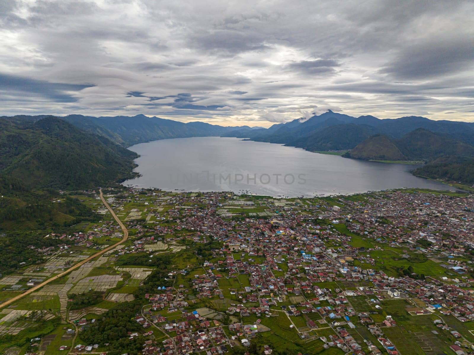 Takengon city in mountains among farmland and Laut tawar lake. Sumatra, Indonesia.