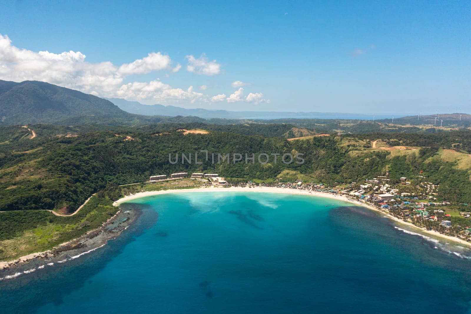 Aerial view of Blue lagoon with sandy beach. Pagudpud, Ilocos Norte, Philippines.