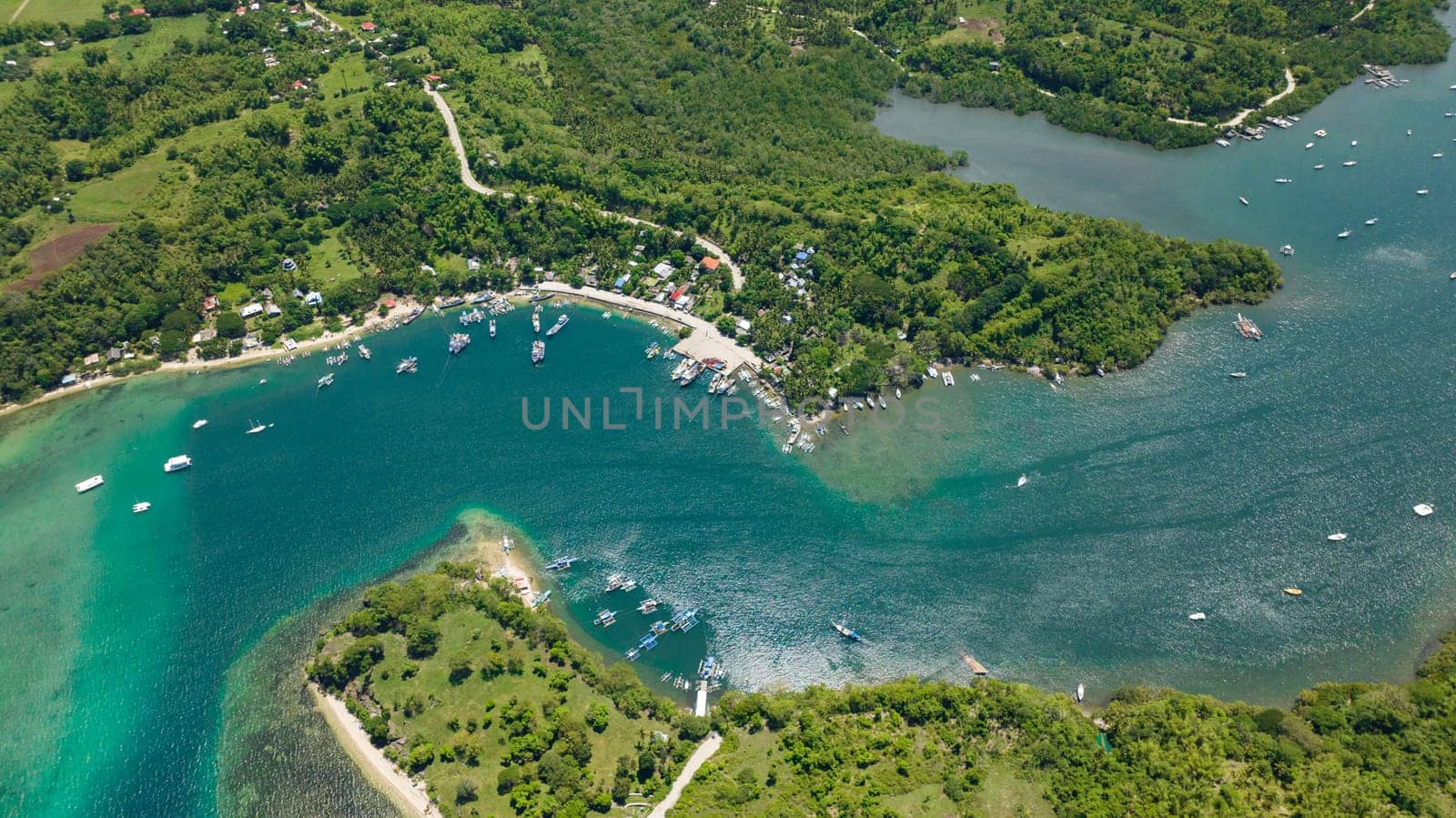 Aerial view of bay with moored boats and yachts. Negros, Philippines.