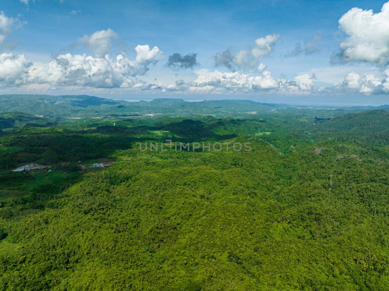 Mountain landscape with mountain peaks covered with forest. Negros, Philippines