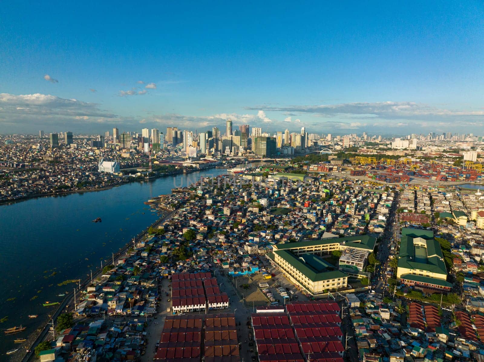 Top view of panorama of the city of Manila with skyscrapers and the port area.