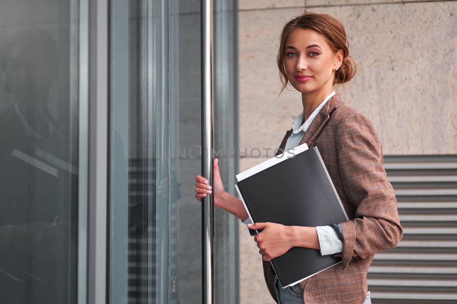 Businesswoman successful woman business person open door small business new opportunities Caucasian professional business woman documents Bank worker open door new opportunities concept interview