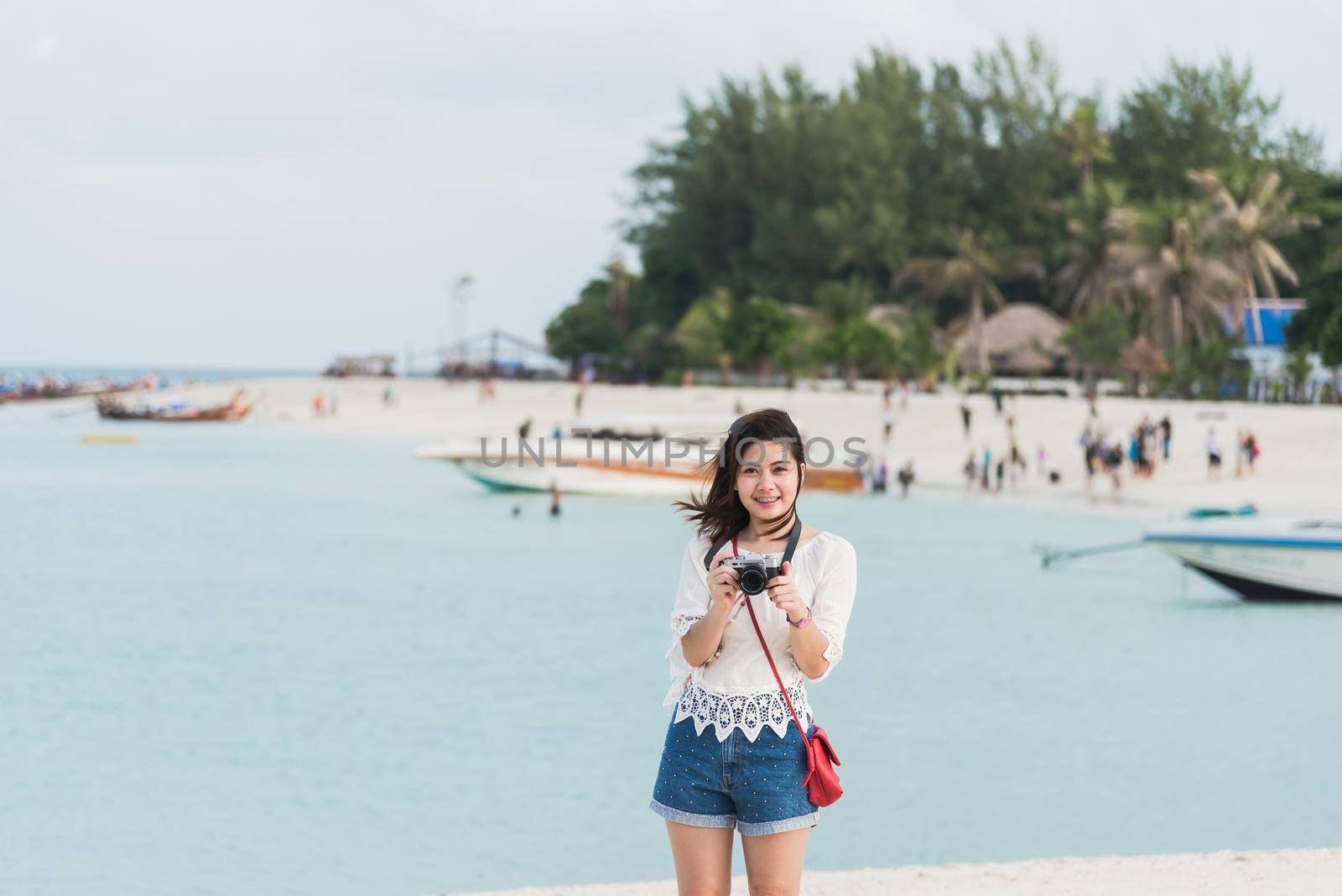 asia girl take photo on the beach