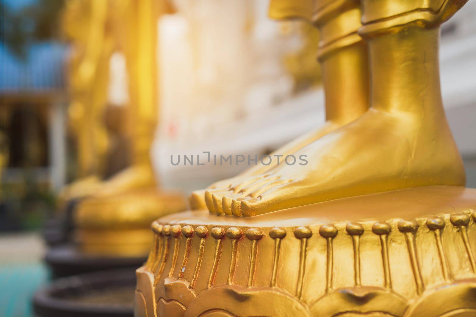 feet of Golden Buddha statue by Wmpix