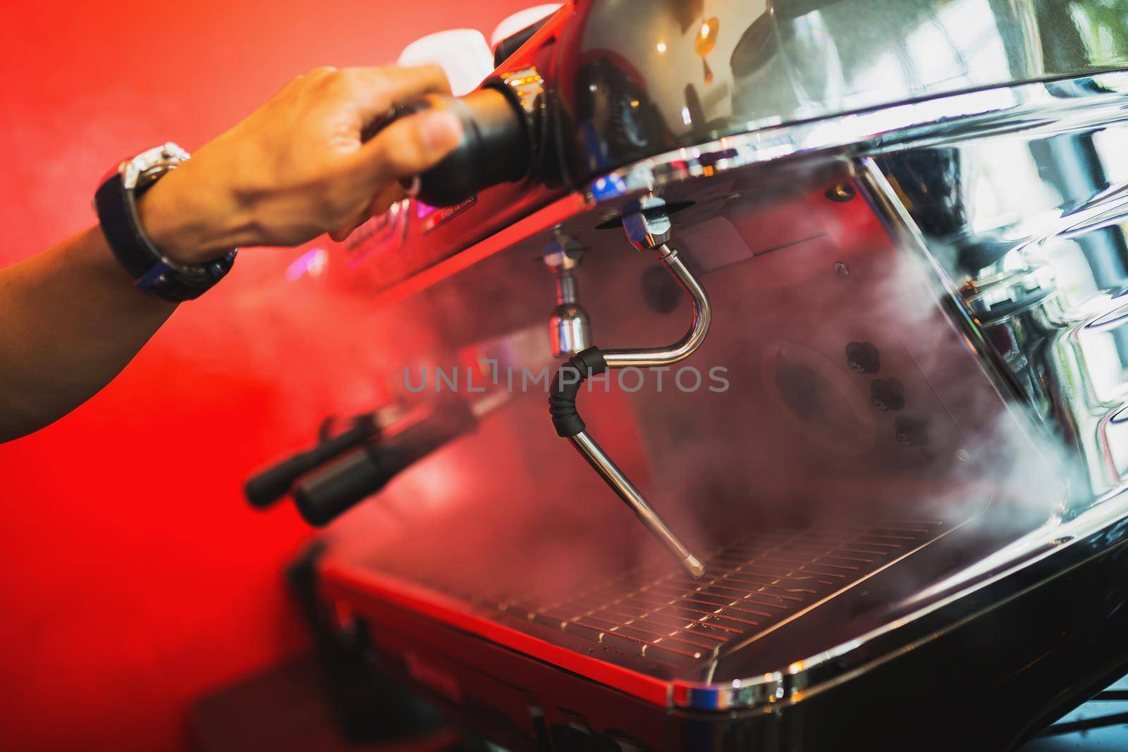 Hand of barista make coffee machine at coffee shop by Wmpix