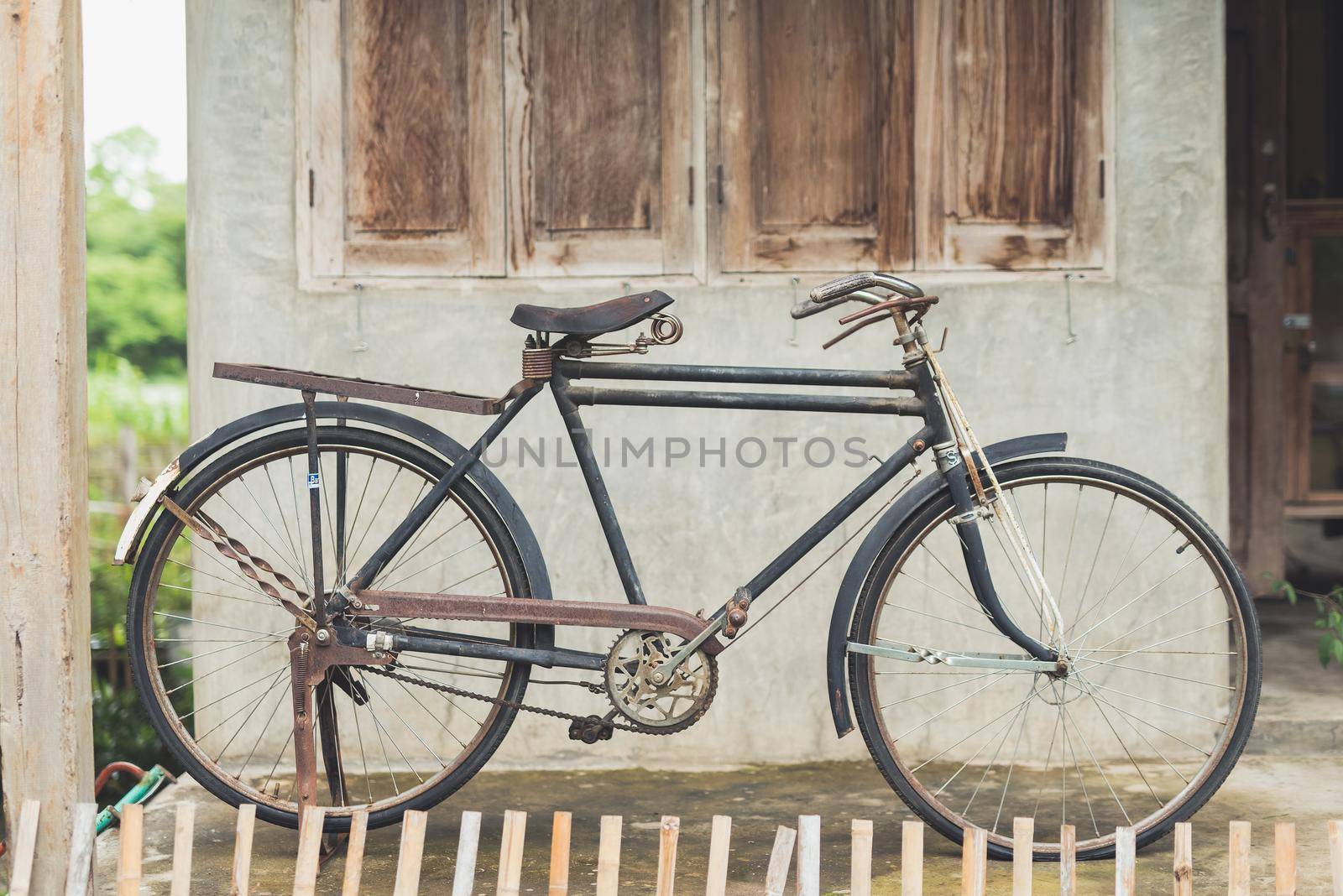 Vintage bicycle at old house by Wmpix
