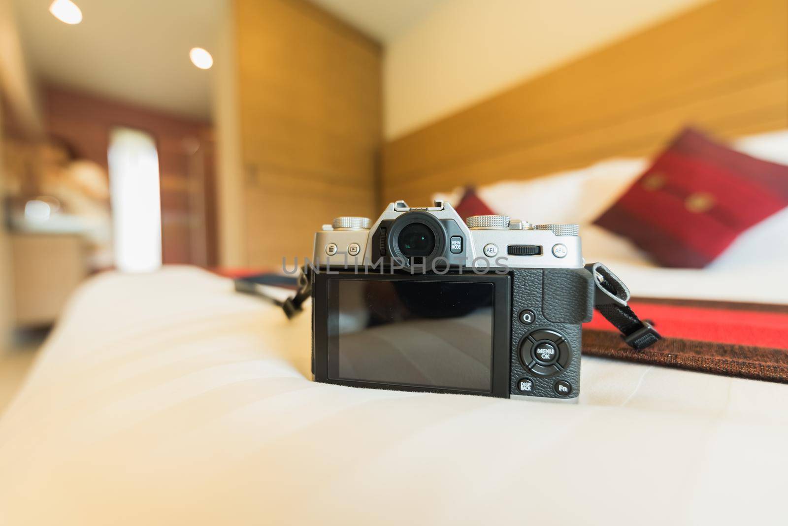 camera on bed by Wmpix