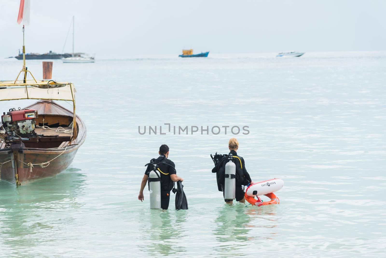 scuba divers looking out to the