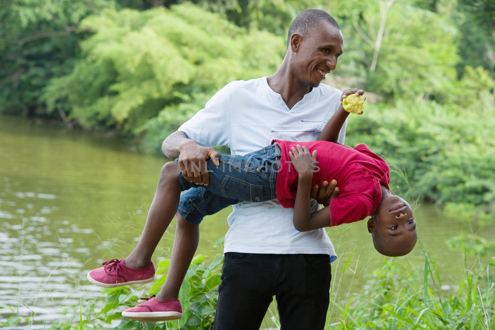 Happy father and little son playing and having fun outdoors .Concept of family, childhood and paternity united and happy