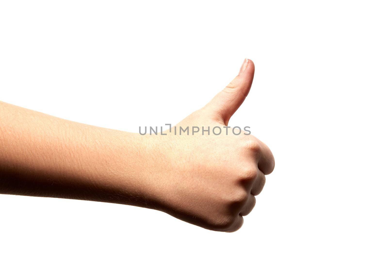 Female teenage hand showing thumbs up isolated on white background. Thumb up. Like finger up gesture.