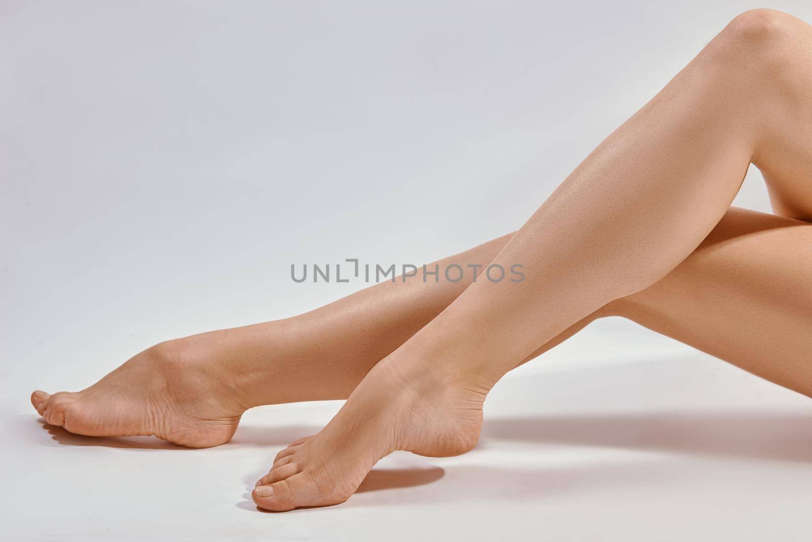 Beautiful female legs and on a light background