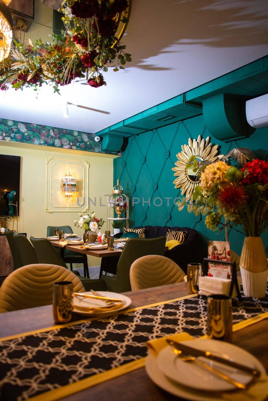 vip room for a small company in a restaurant. decor and serving of the restaurant in the evening by Pukhovskiy