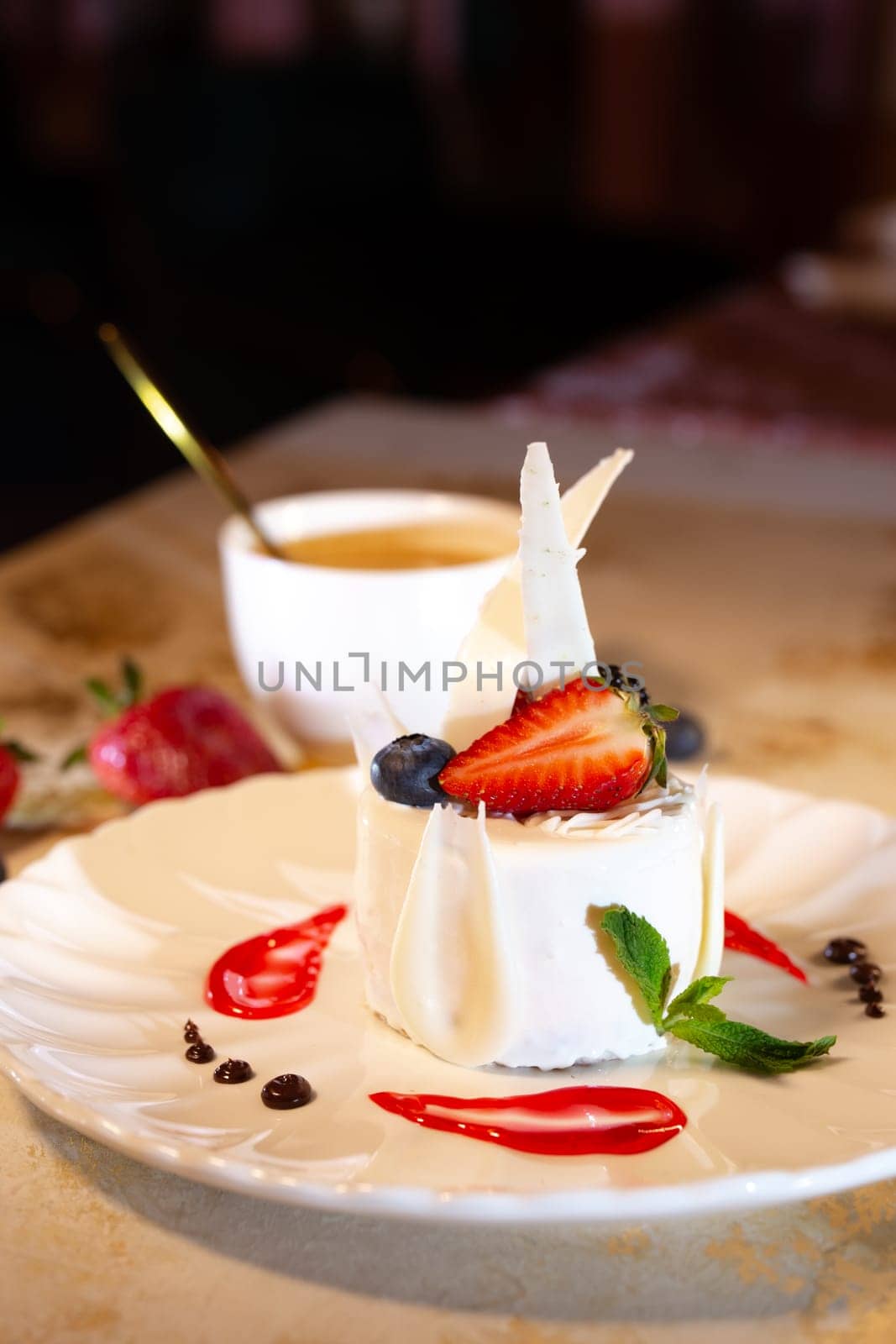 a beautiful fresh white dessert in a restaurant on the table. original dessert serving by Pukhovskiy