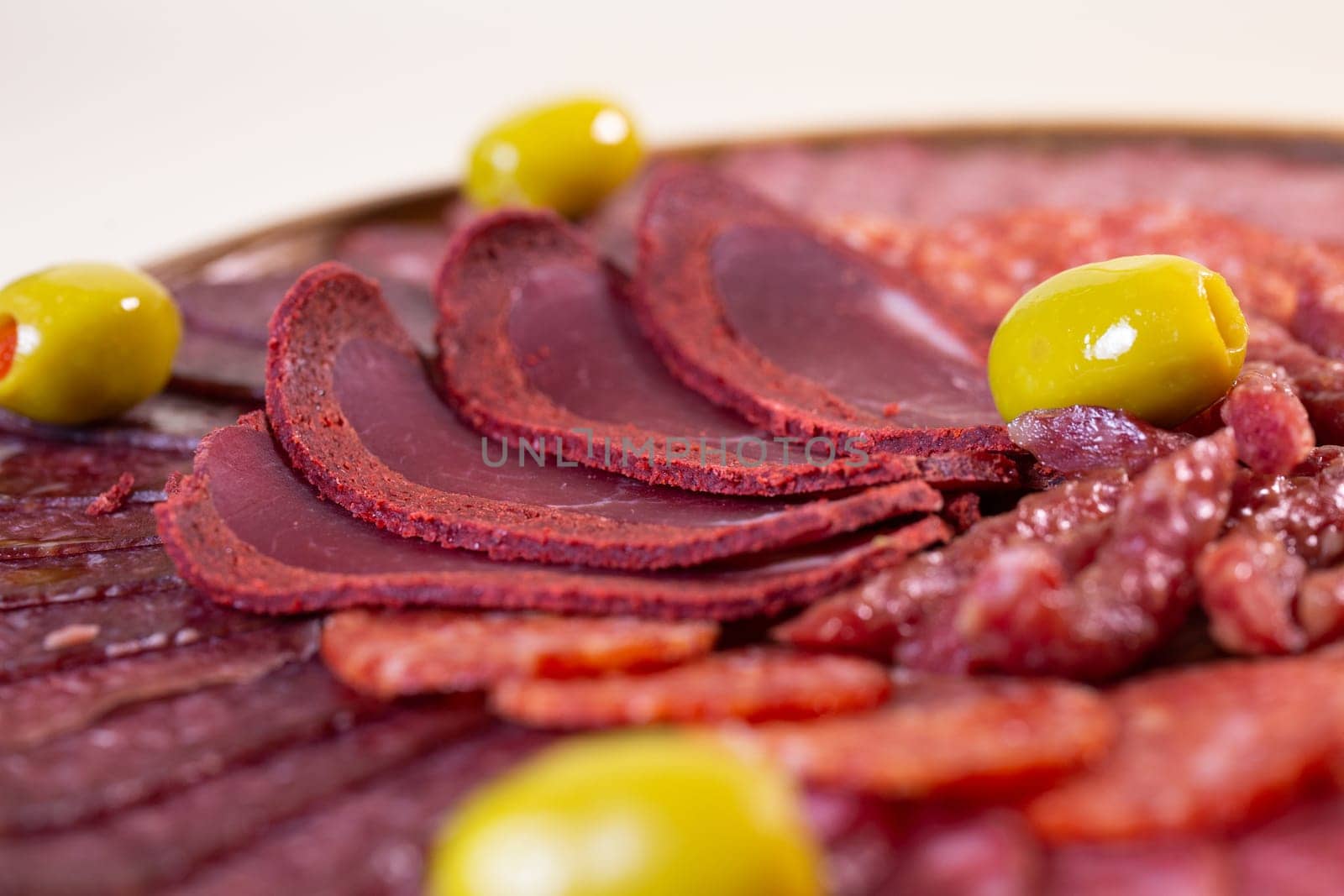 close-up of meat sliced from delicacies on a wooden stand. by Pukhovskiy