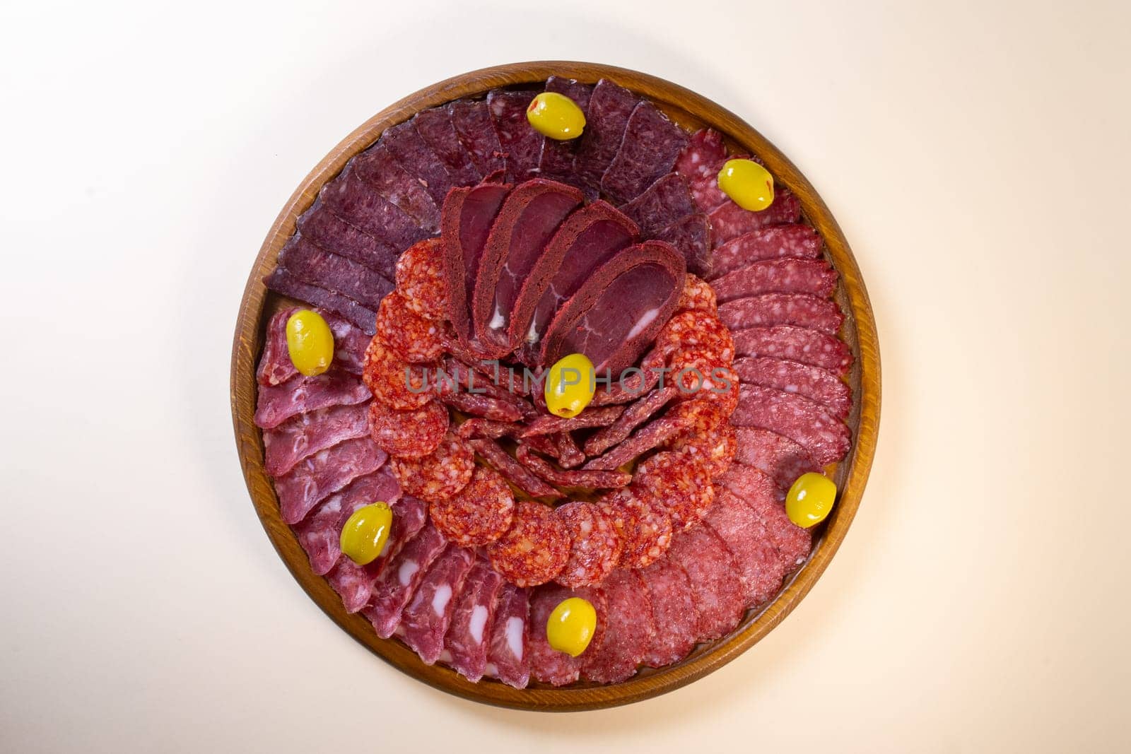 meat sliced from delicacies on a wooden stand top view by Pukhovskiy