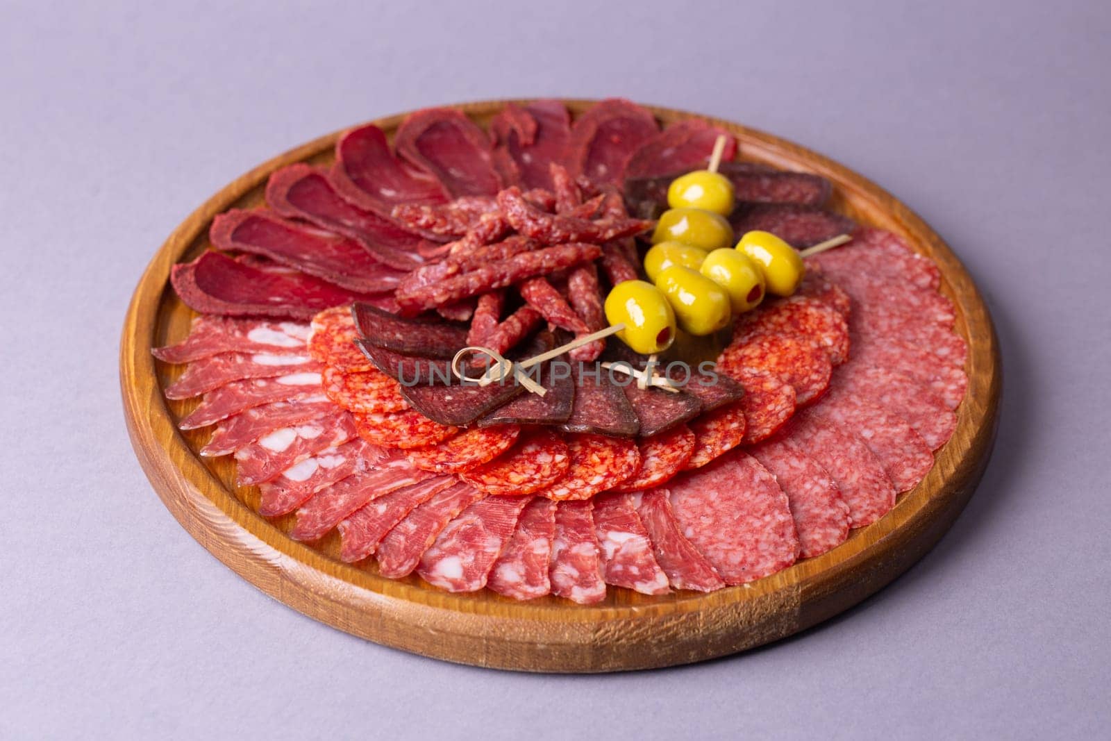 meat sliced from delicacies on a wooden stand by Pukhovskiy