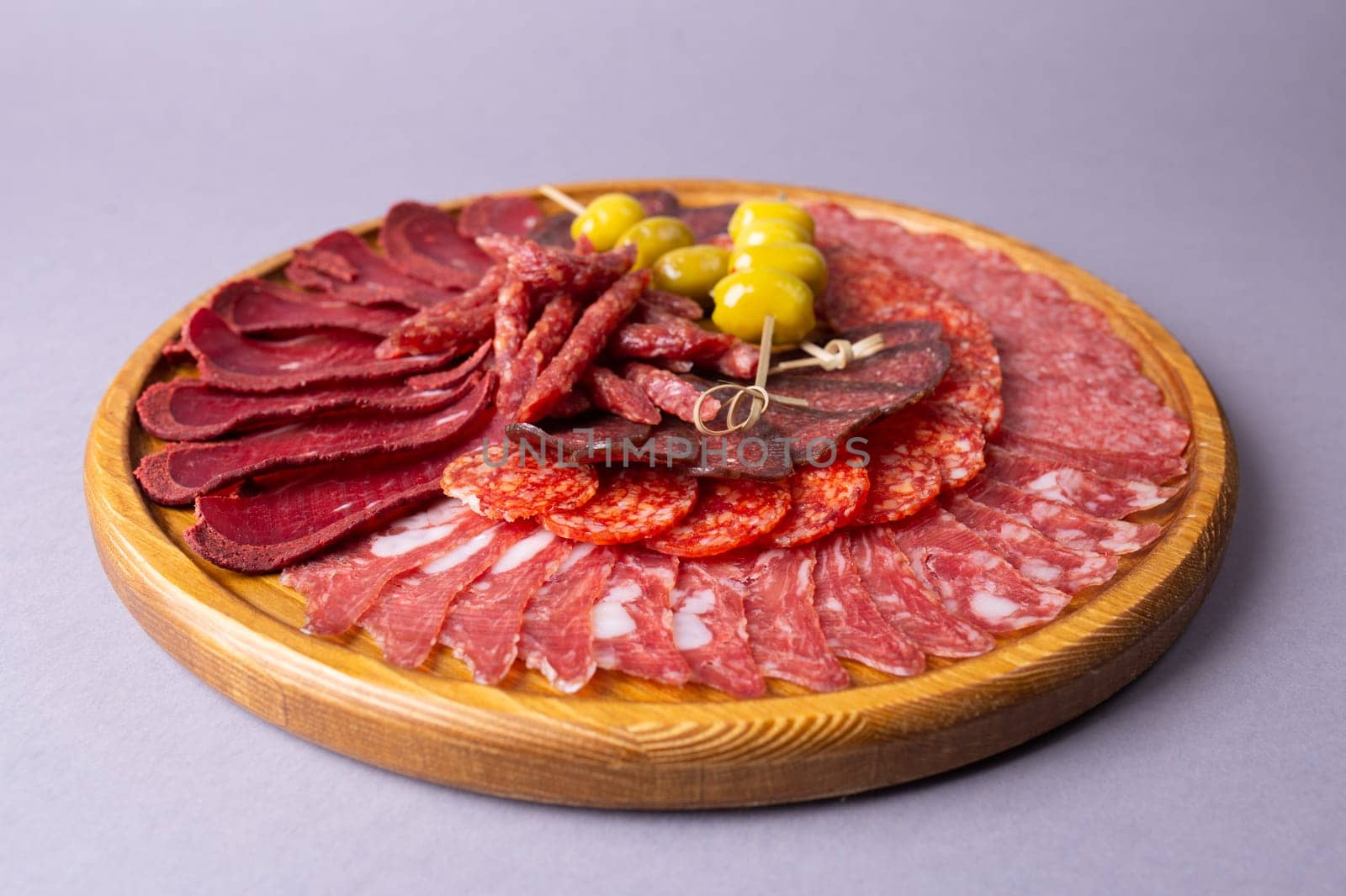 meat sliced from delicacies on a wooden stand.