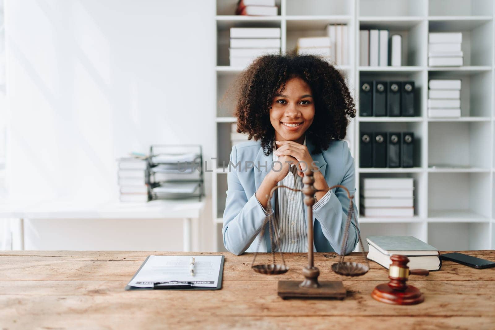 A young women African American lawyer lawsuit studying cases for clients in a law firm to fight against their parties in the courts. law and attorney concepts