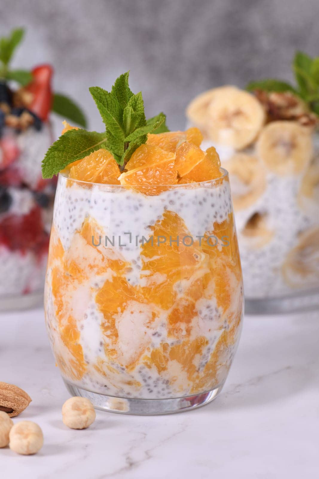 Chia dessert with Greek yogurt and orange slices. Absolutely helpful. Perfect breakfast or snack. Suitable for vegans and gluten free.