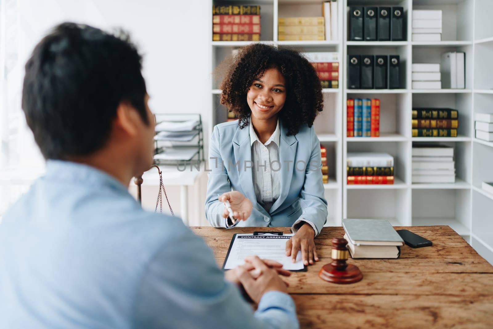 african american attorney, lawyers discussing contract or business agreement at law firm office, Business people making deal document legal, justice advice service concepts.