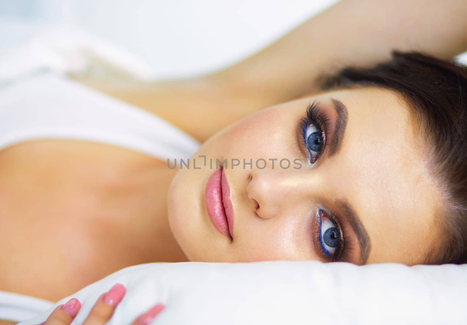 Young beautiful woman lying in bed. by lenets