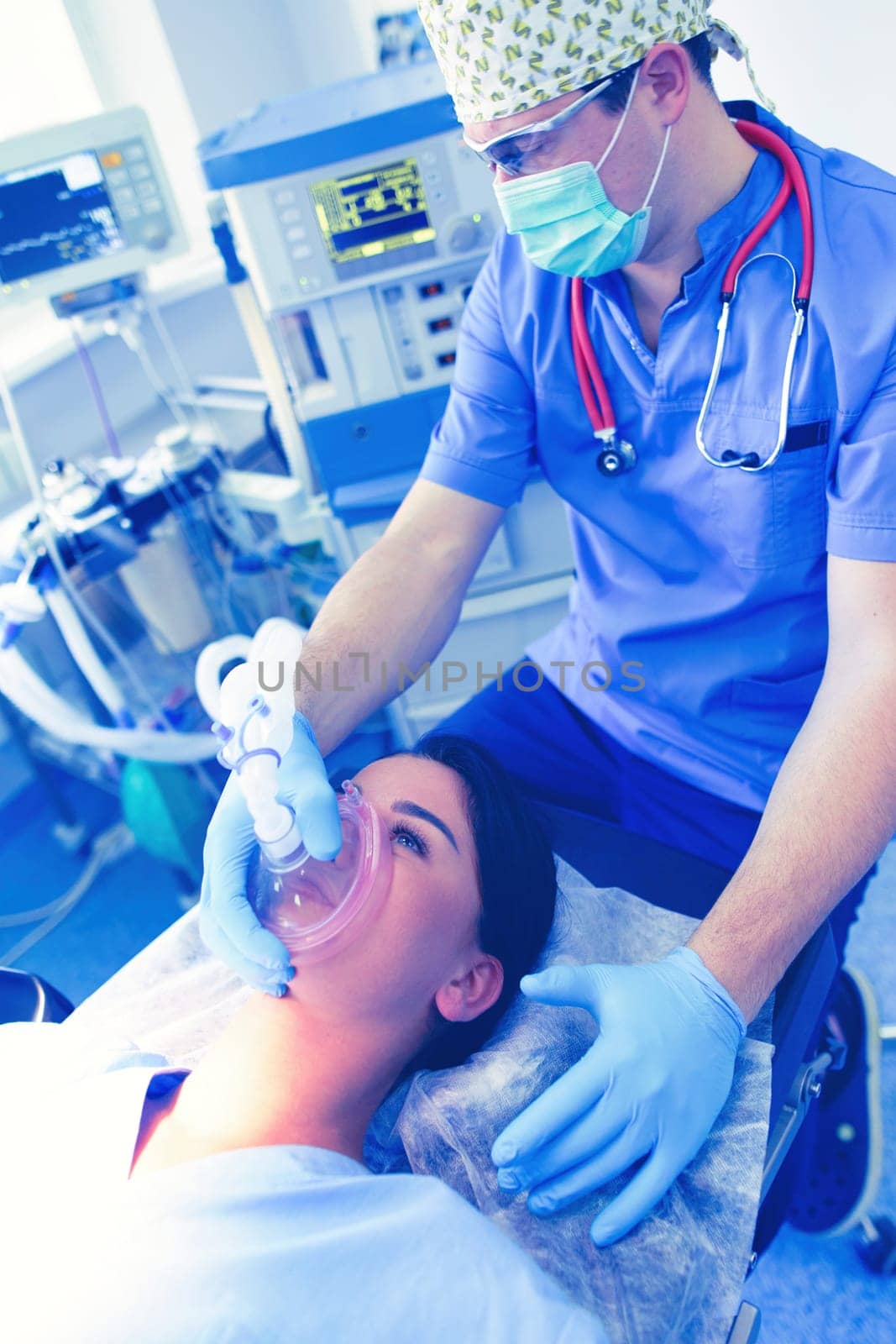 Man surgeon at work in operating room.