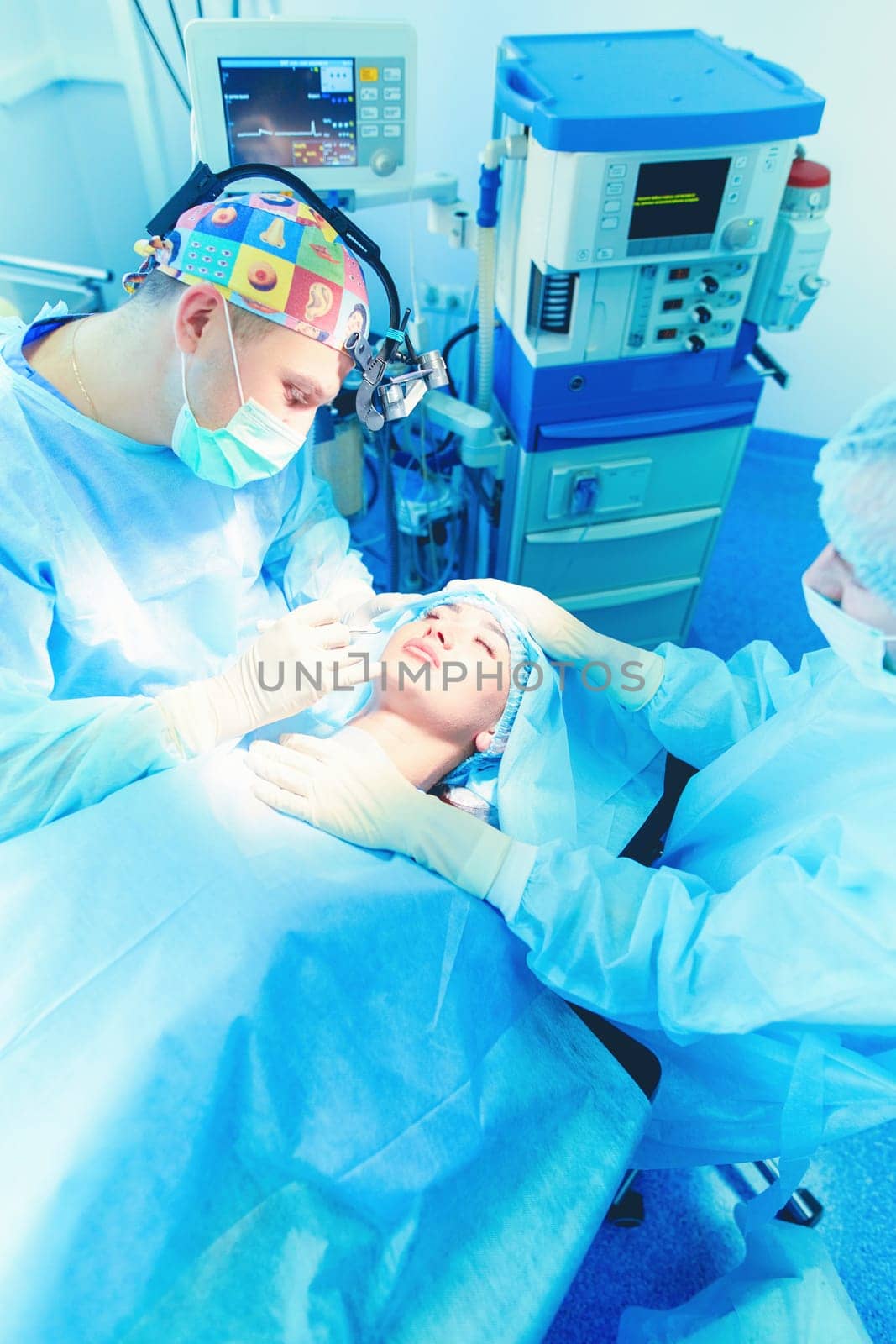 Man surgeon at work in operating room.