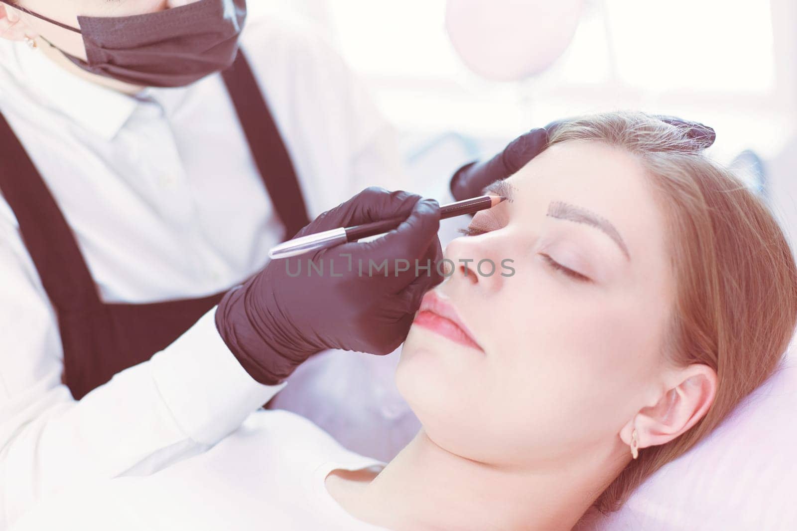 Microblading eyebrows work flow in a beauty salon. by lenets