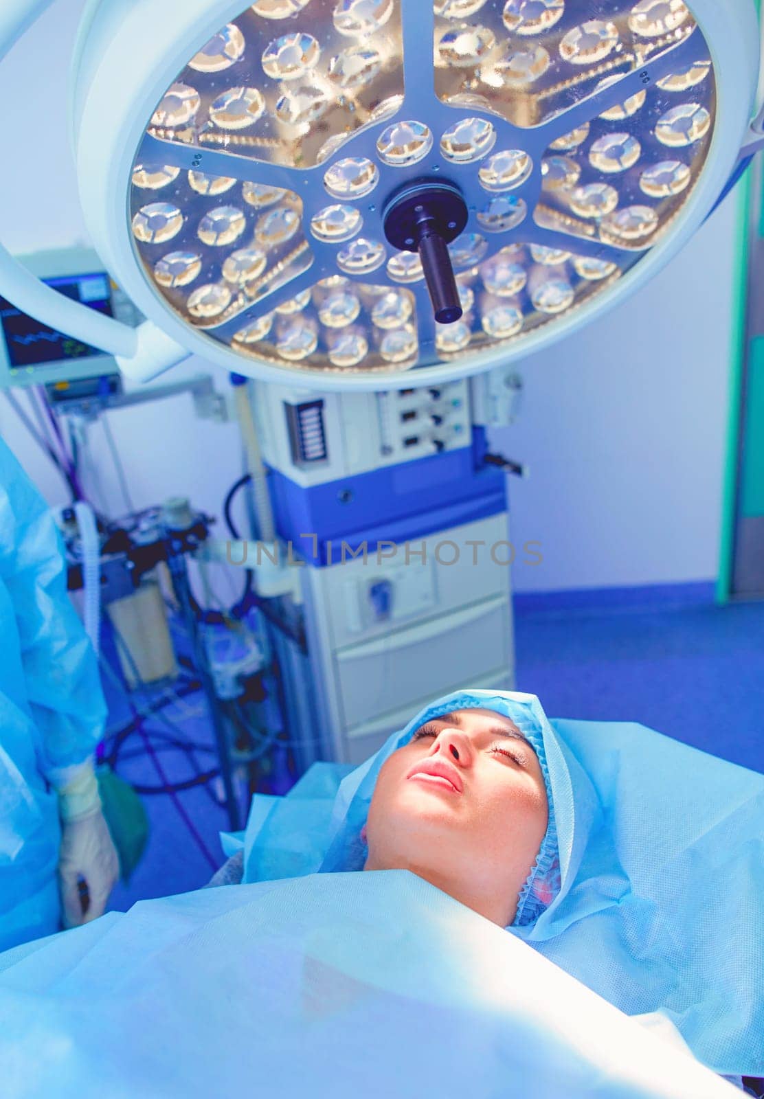 Man surgeon at work in operating room.