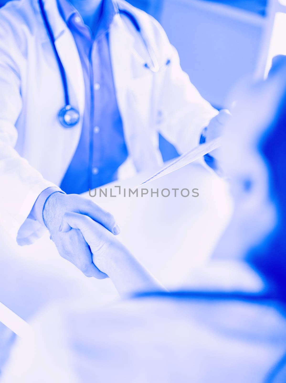 Doctor shakes hands with a patient isolated on white background.