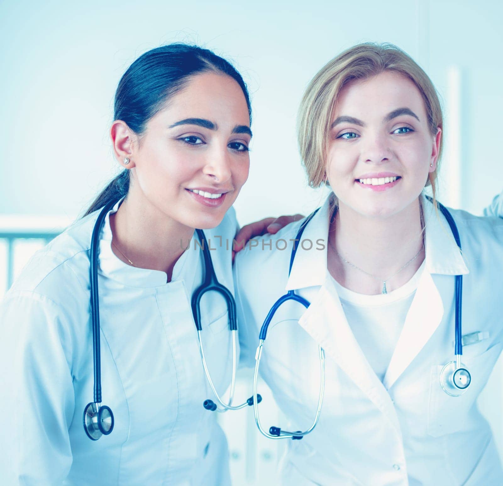 Successful medical team. Confident doctors team standing together and smiling.