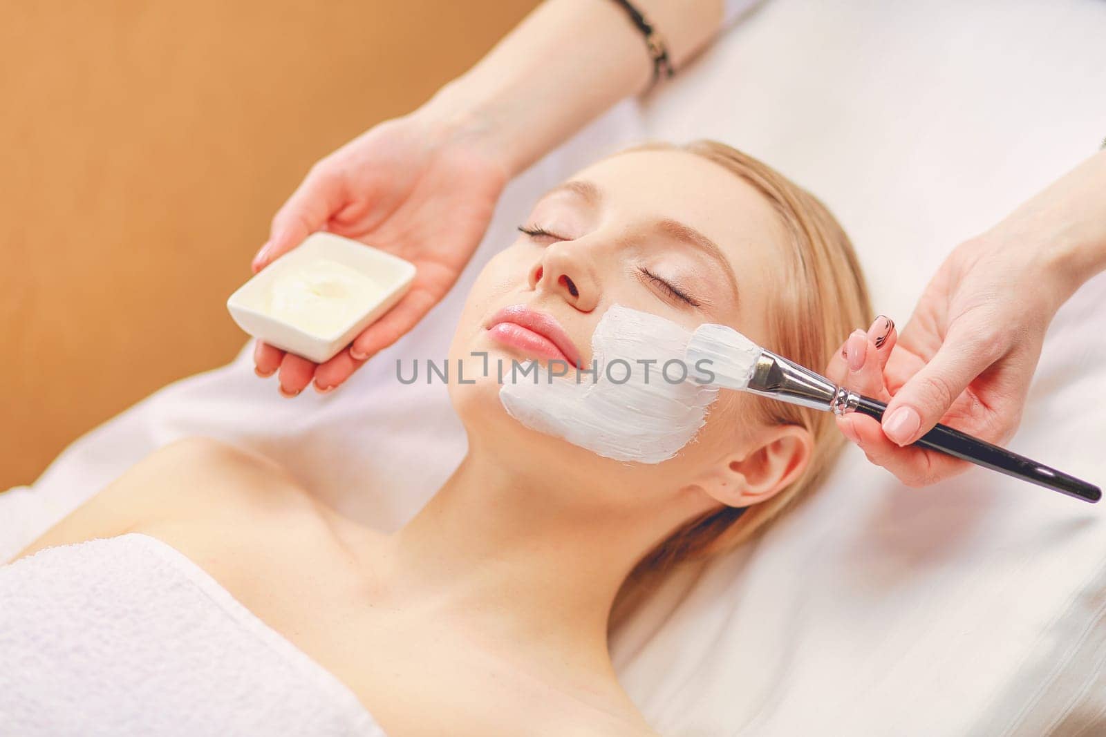 Spa facial mask application. Spa beauty organic facial mask application at day spa salon