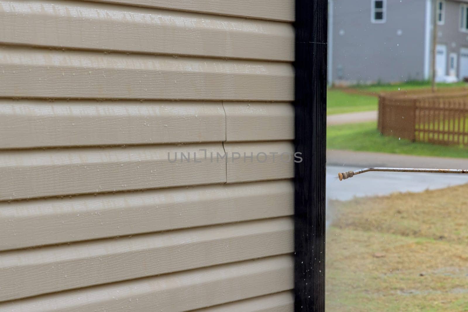 High pressure nozzles are a power washer tool for washing siding houses with water soap cleaner. by ungvar