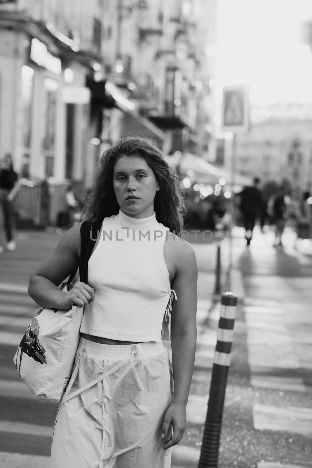 A street portrait of a beautiful young woman. High quality photo