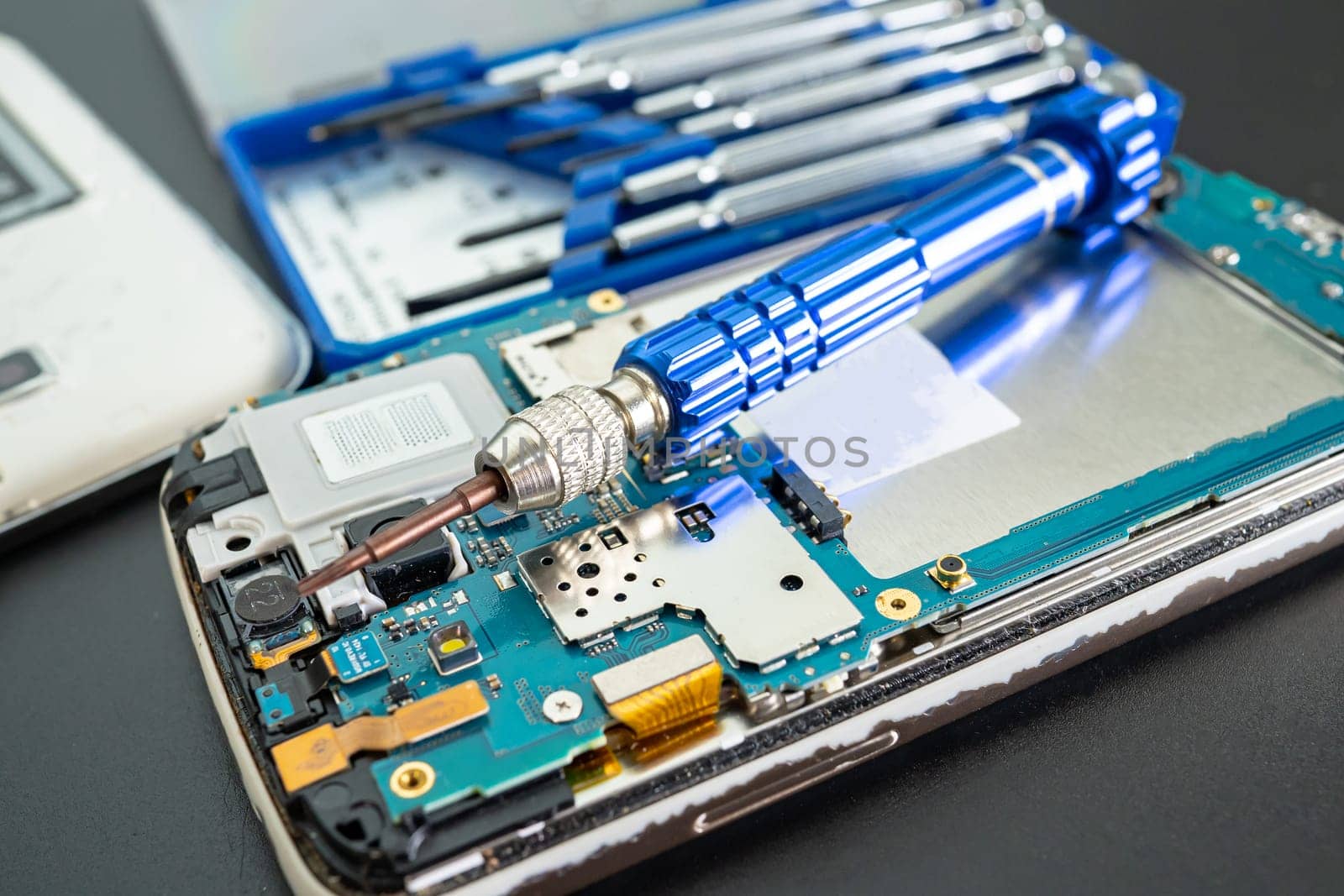 Repairing and upgrade Samsung mobile phone, electronic, computer hardware and technology concept. by pamai