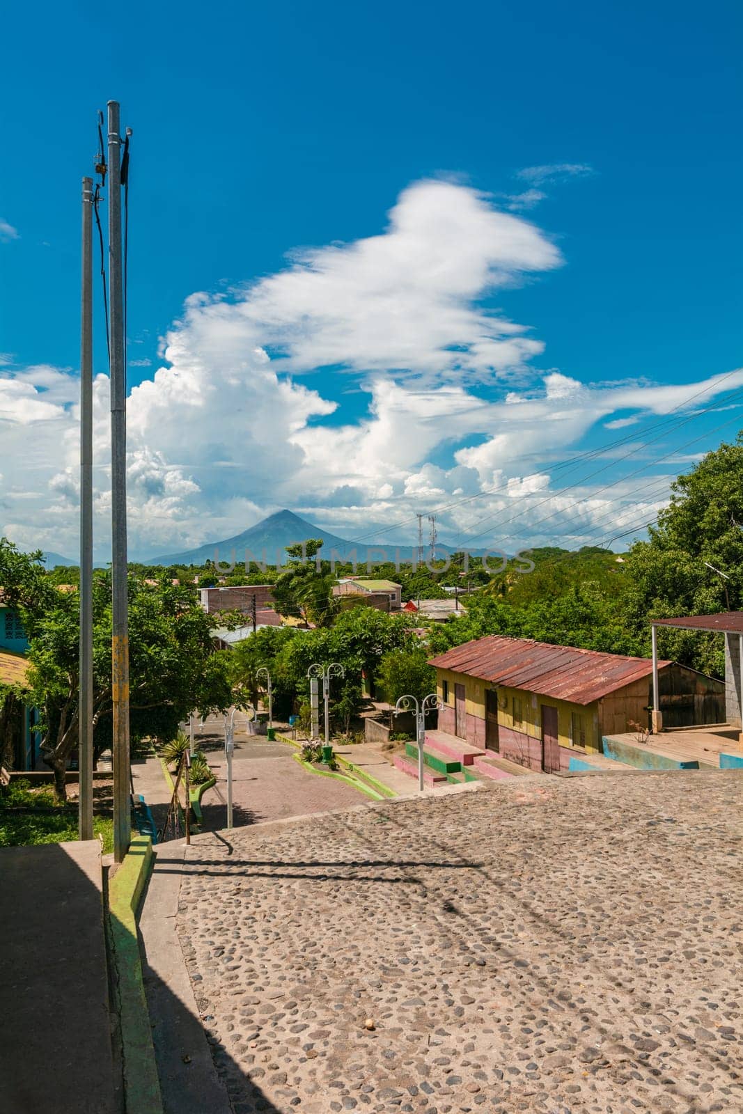 Streets of Nagarote with a view of the momotombo volcano on a beautiful day. View of the Momotombo volcano, from Nagarote