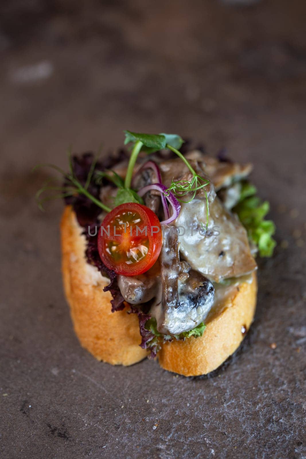 close-up bruschetta with mushrooms and chicken tomato.