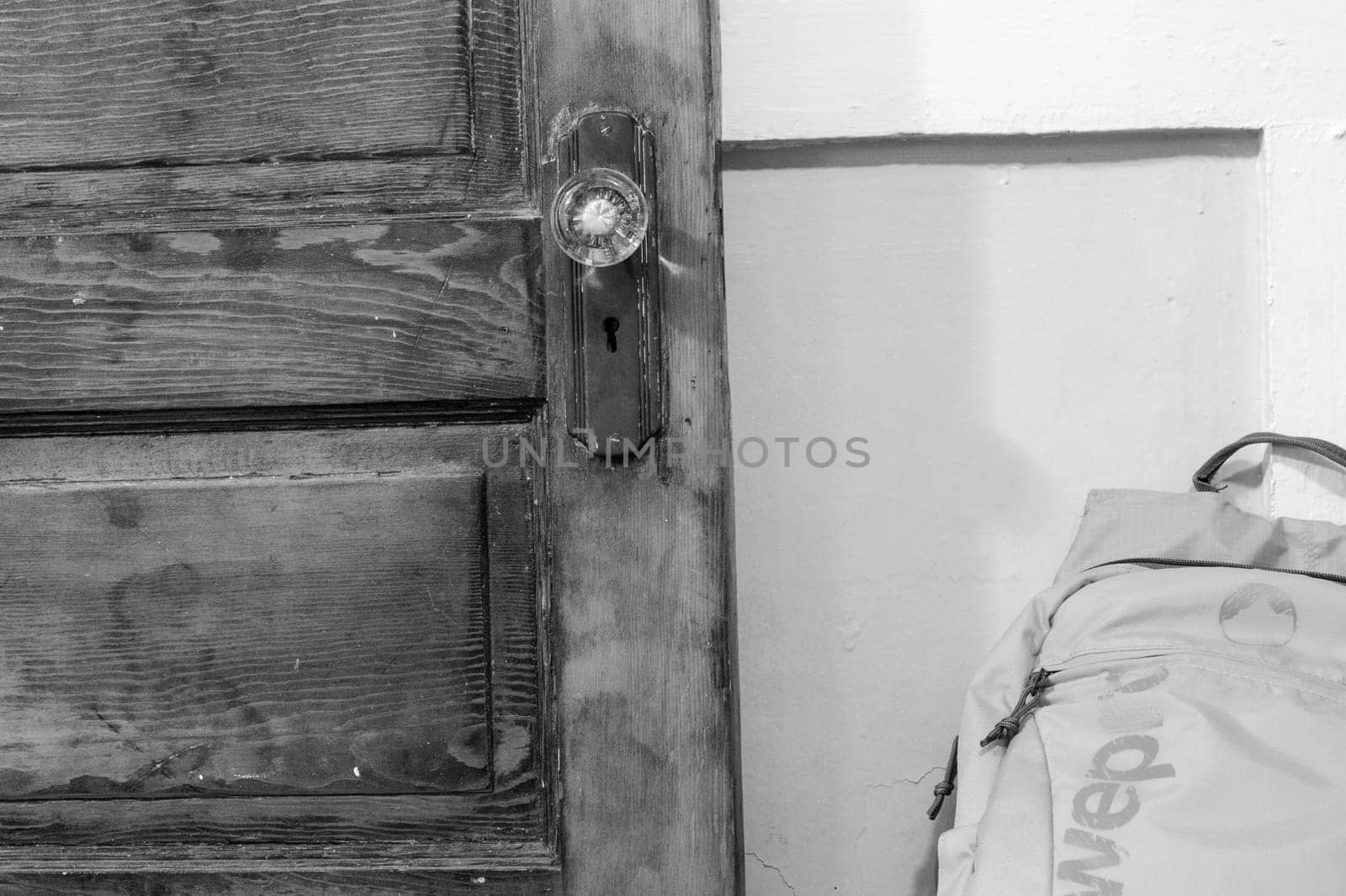 Black and white photo of an old door close up on the handle . High quality photo