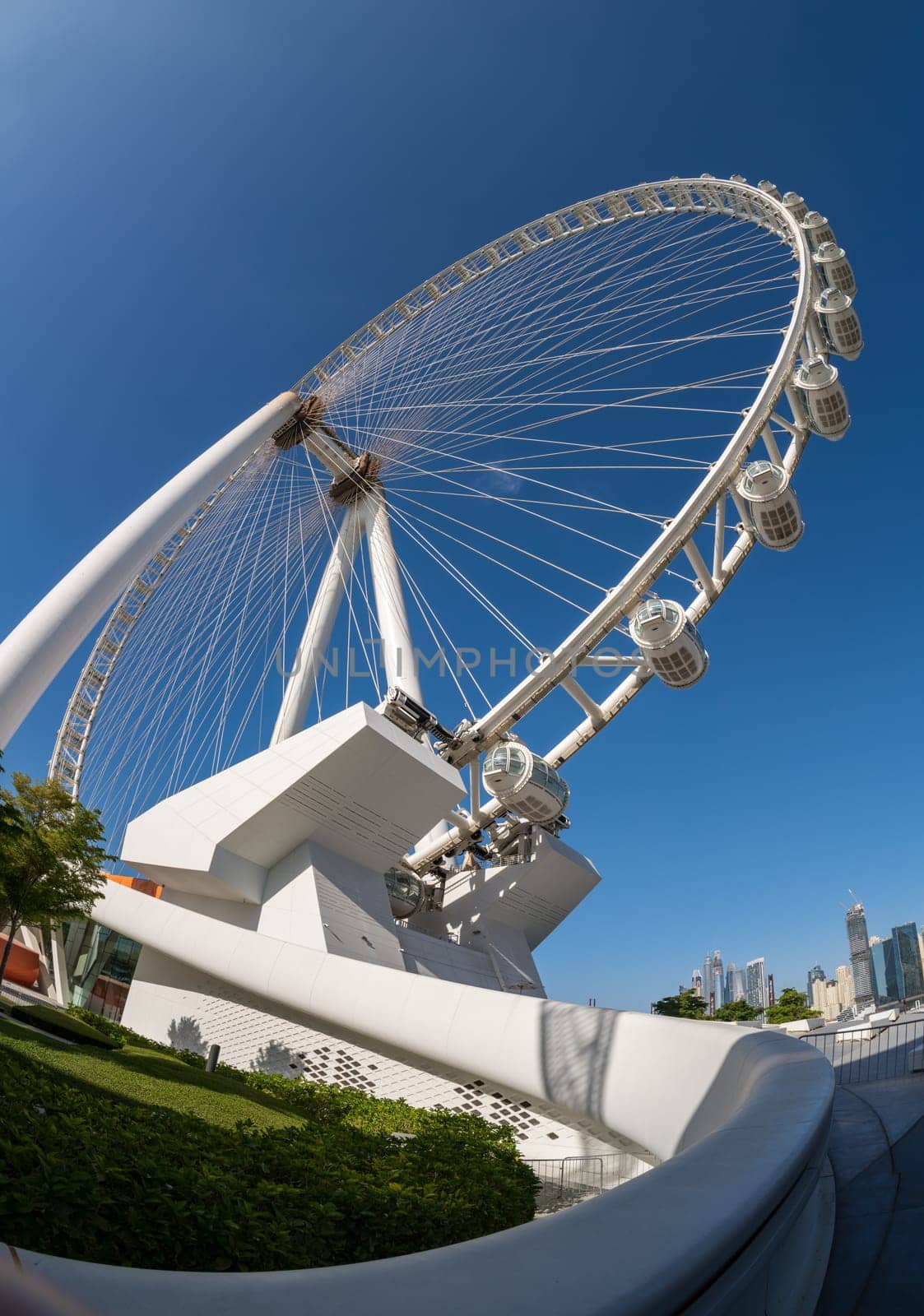 Looking up with fish eye lens at Ain Dubai Observation Wheel on BlueWaters Island with JBR Beach in background