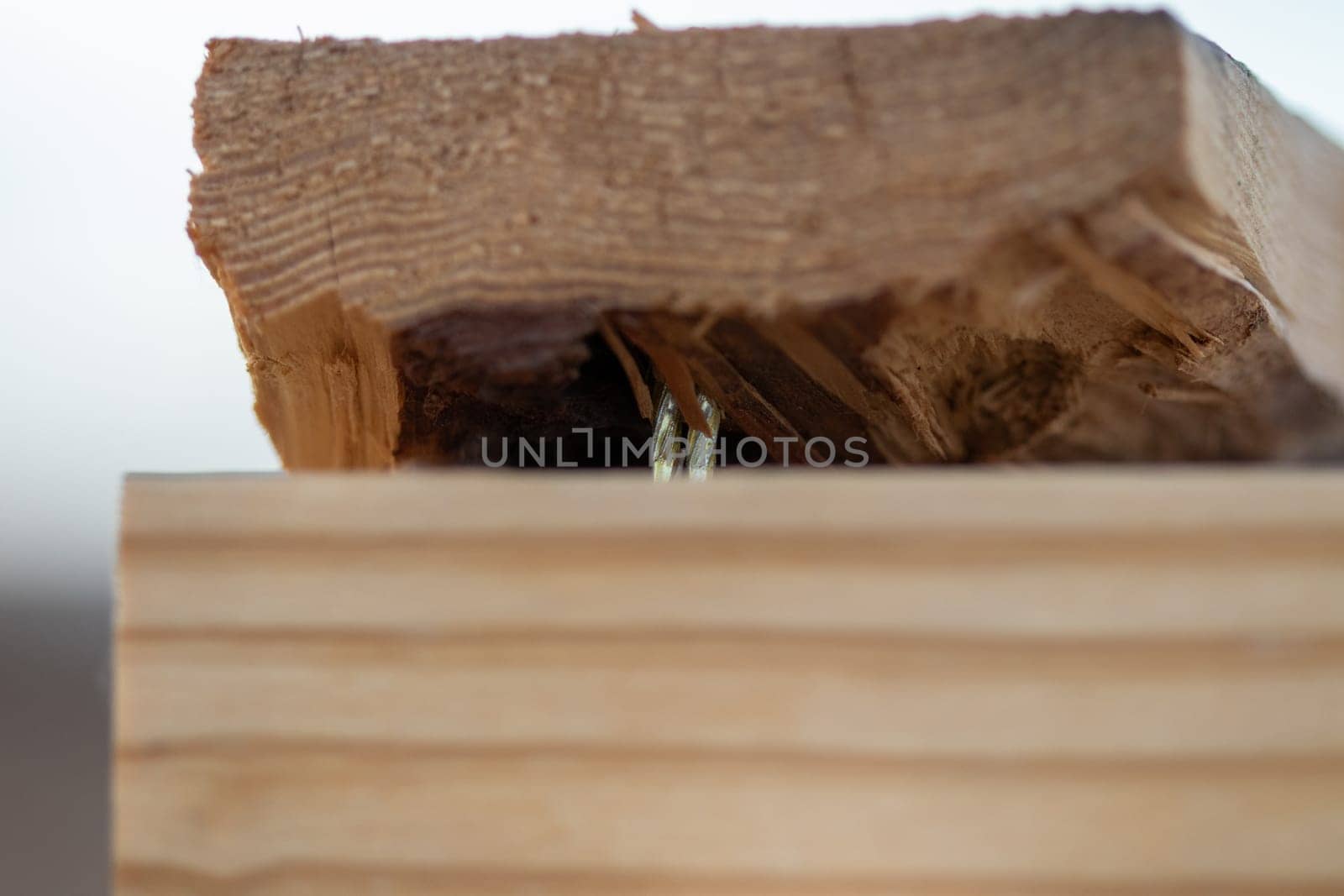 Close up of two 2x4 nailed together by gena_wells