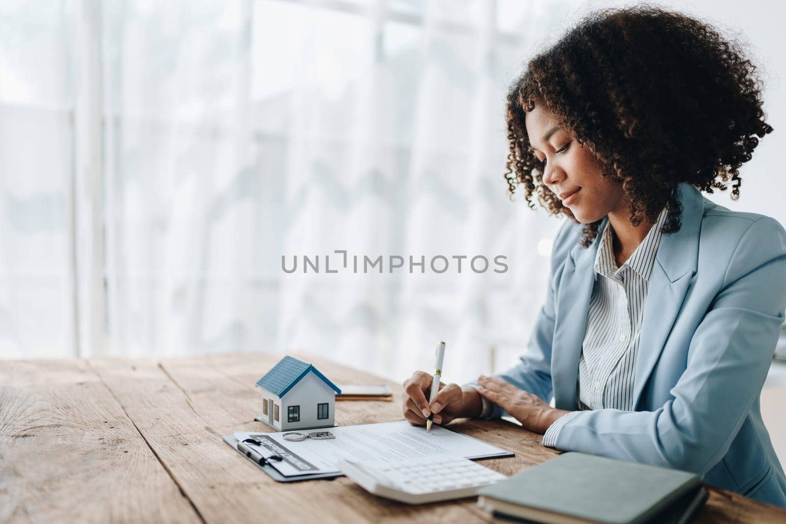 Guarantee, Mortgage, agreement, contract, Signing,woman african american client holding pen to reading agreement document to sign land loan with real estate agent or bank officer, insurance concepts by Manastrong