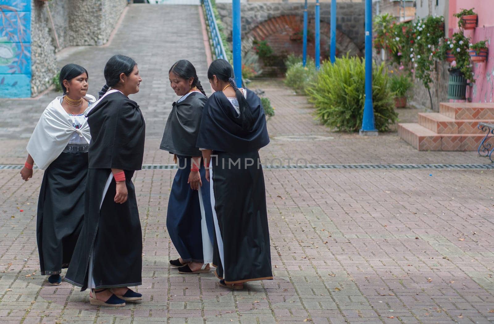 copyspace of four indigenous people performing a traditional inti raymi dance in Ecuador. High quality photo