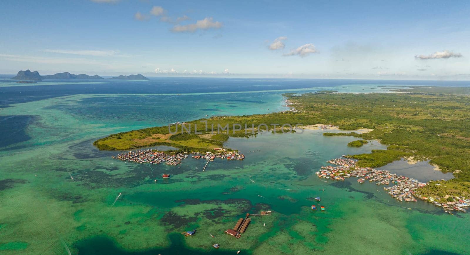 Top view of coast of the island Bum Bum with towns and villages. Tun Sakaran Marine Park. Borneo, Sabah, Malaysia.