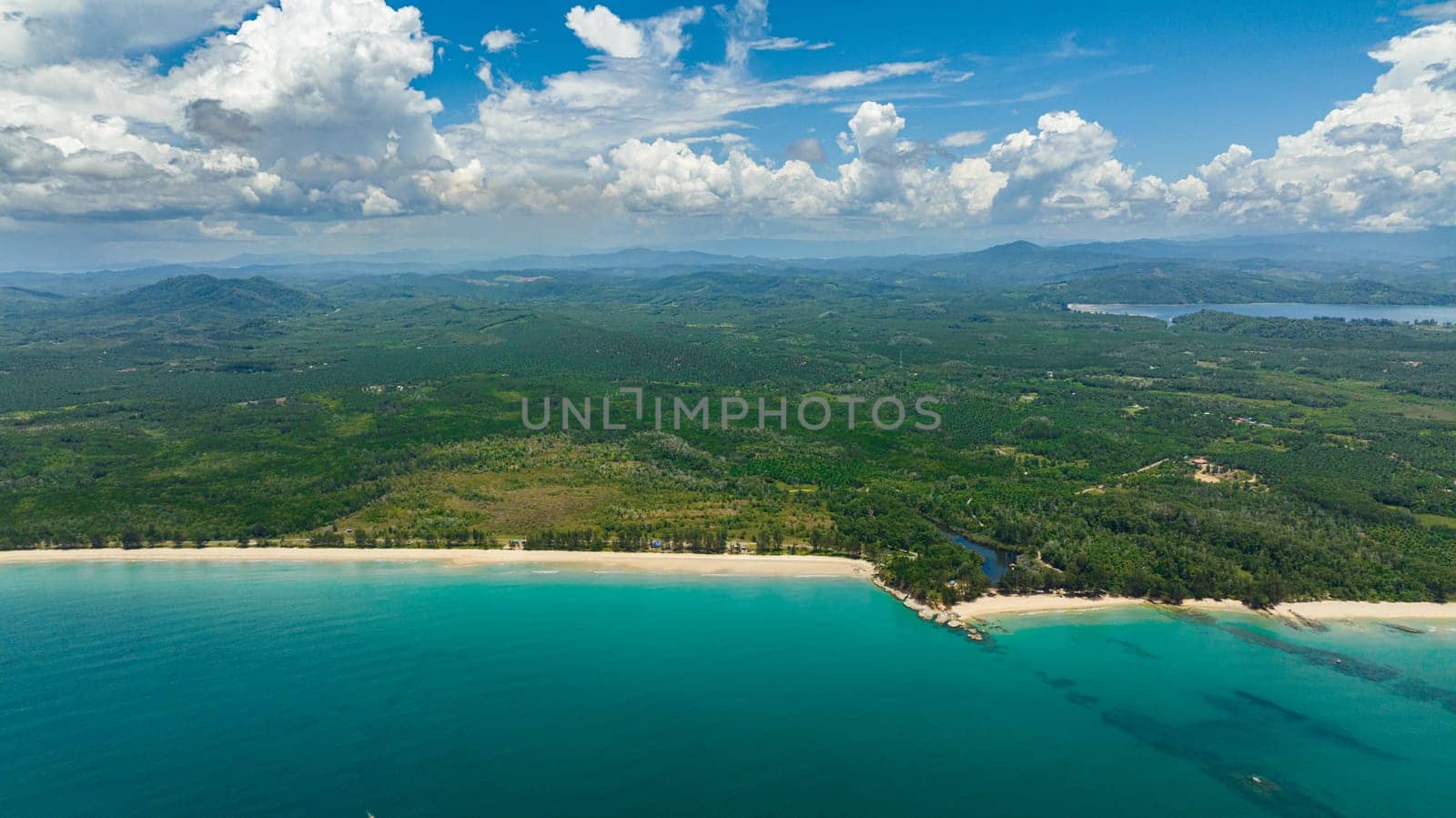 Sandy beach and turquoise water in the tropics. Borneo, Malaysia.
